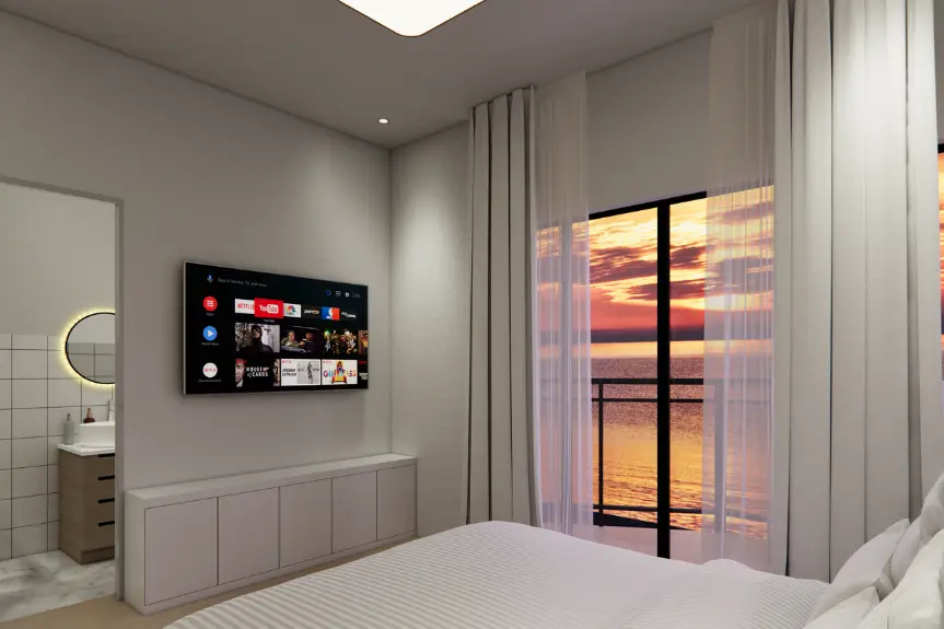 1 Bedroom Apartment in Airport Residential featuring TV and ocean sunset view